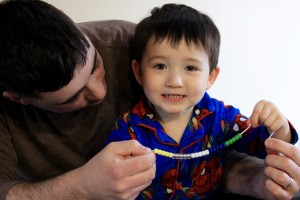 Little G showing off his work on the Genius Box bracelet