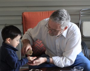 Our Little Roots Papa pouring seeds